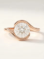 Modern swirl solitaire ring