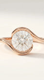 Modern swirl solitaire ring